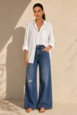 Viscose Oversized Shirt in  white Κωδικός: 200226 Χαρακτηριστικά Προϊόντος • Εφαρμογή: Oversized, χαλαρή γραμμή • One Size – καλύπτει έως X-Large • Περιφέρεια στήθους: έως 120 cm • Μαλακό, ελαφρύ και breathable ύφασμα viscose • Κατάλληλο για ευαίσθητα & αλλεργικά δέρματα • Roll-up μανίκι • Φοριέται ως πουκάμισο ή ελαφρύ jacket • Ιδανικό για layering Διαστάσεις (flat ) • Στήθος: έως 120 cm • Μήκος μπροστά: περίπου 72 cm • Μήκος πίσω: περίπου 76 cm • Μανίκι: περίπου 60 cm Φροντίδα • Πλύσιμο στο πλυντήριο έως 30°C • Χωρίς στύψιμο • Σιδέρωμα σε χαμηλή θερμοκρασία